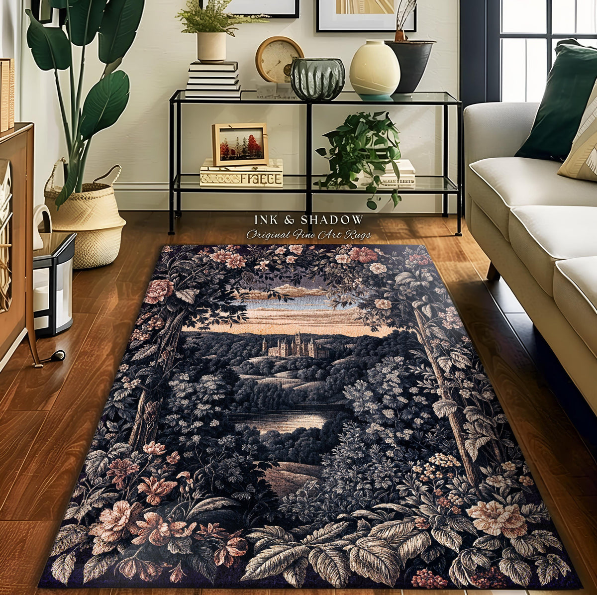 May include: A rectangular area rug with a detailed landscape design featuring a castle, trees, and flowers in shades of blue, gray, and pink. The rug has the text "INK & SHADOW Original Fine Art Rugs".
