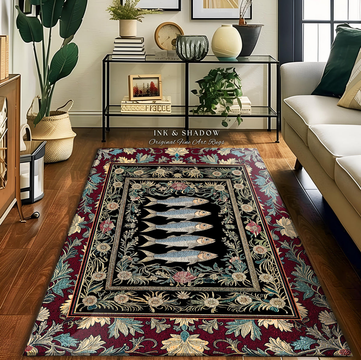 May include: A rectangular area rug with a black center featuring five stylized fish. The rug has a floral border in burgundy, teal, and cream. The text "INK & SHADOW Original Fine Art Rugs" is printed on the rug.
