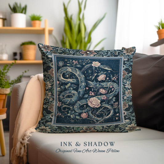 May include: A blue and green woven pillow with a snake and floral design. The pillow has a square frame and the text "INK & SHADOW Original Fine Art Woven Pillow" is printed below the image.